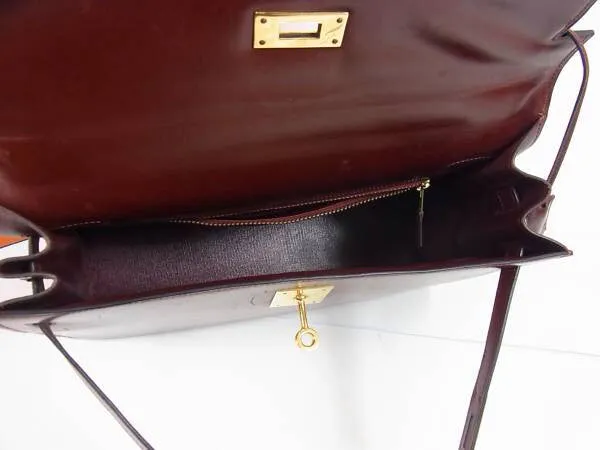 1980s Vintage HERMES Kelly 32 bag rouge ash box calf leather with gold hardware. Exterior stitch. Stamp K in O, 1981. Best known classic bag