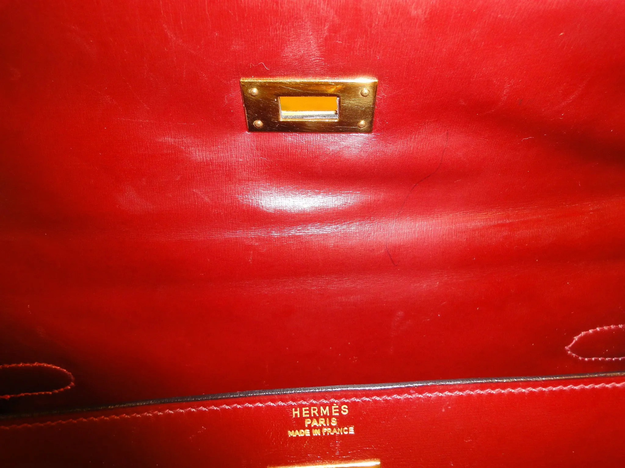 1980s Vintage HERMES Kelly 32 bag rouge ash box calf leather with gold hardware. Exterior stitch. Stamp K in O, 1981. Best known classic bag
