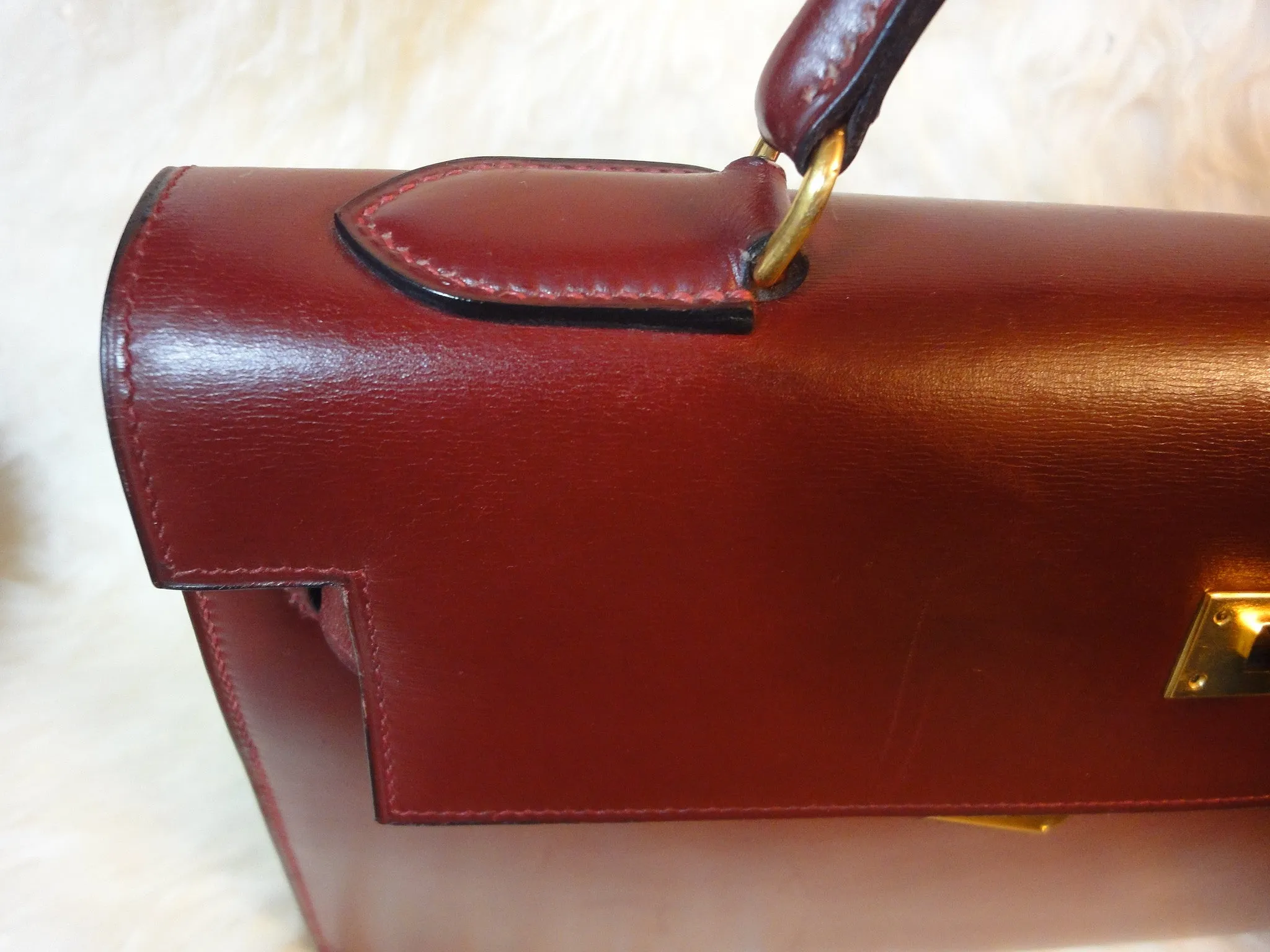 1980s Vintage HERMES Kelly 32 bag rouge ash box calf leather with gold hardware. Exterior stitch. Stamp K in O, 1981. Best known classic bag