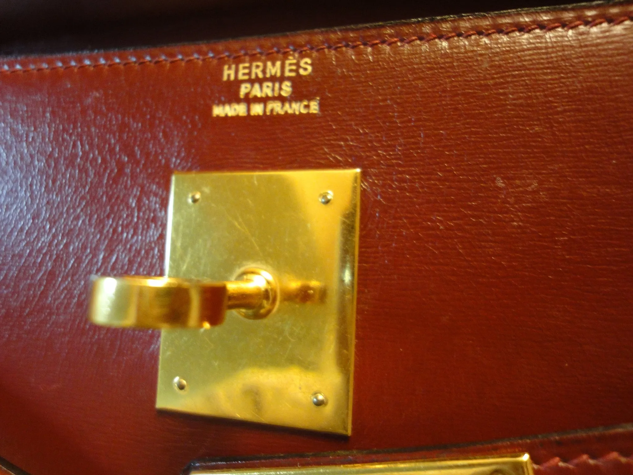 1980s Vintage HERMES Kelly 32 bag rouge ash box calf leather with gold hardware. Exterior stitch. Stamp K in O, 1981. Best known classic bag