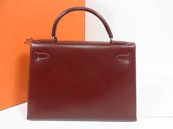 1980s Vintage HERMES Kelly 32 bag rouge ash box calf leather with gold hardware. Exterior stitch. Stamp K in O, 1981. Best known classic bag