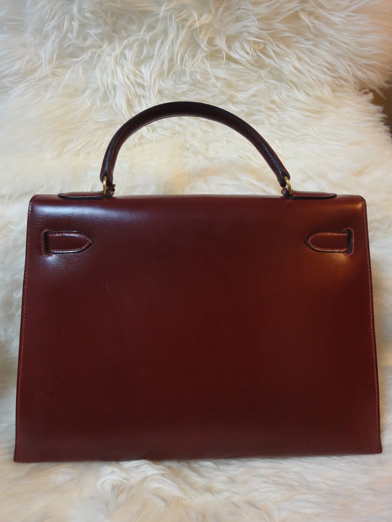 1980s Vintage HERMES Kelly 32 bag rouge ash box calf leather with gold hardware. Exterior stitch. Stamp K in O, 1981. Best known classic bag