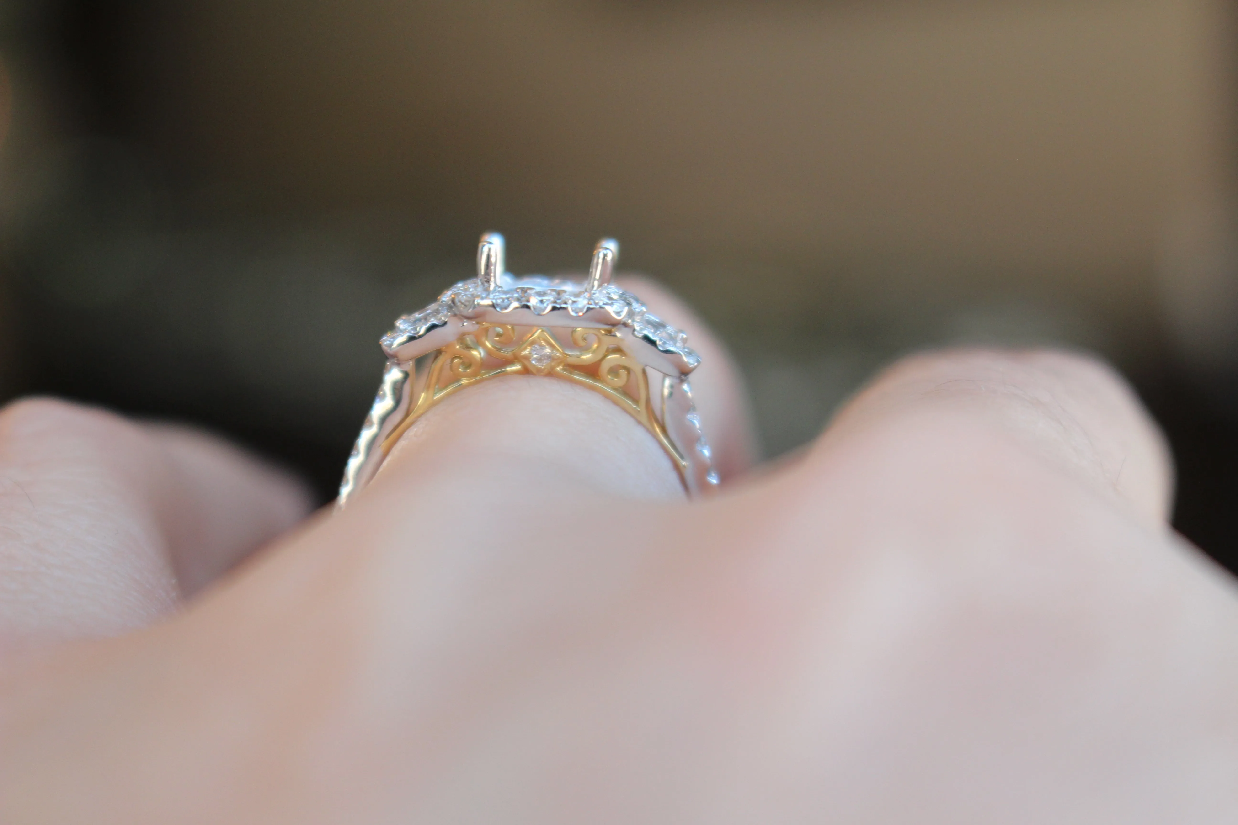 Diamondaire 3 Stone Halo Engagement Ring with a Two-Tone Undercarriage