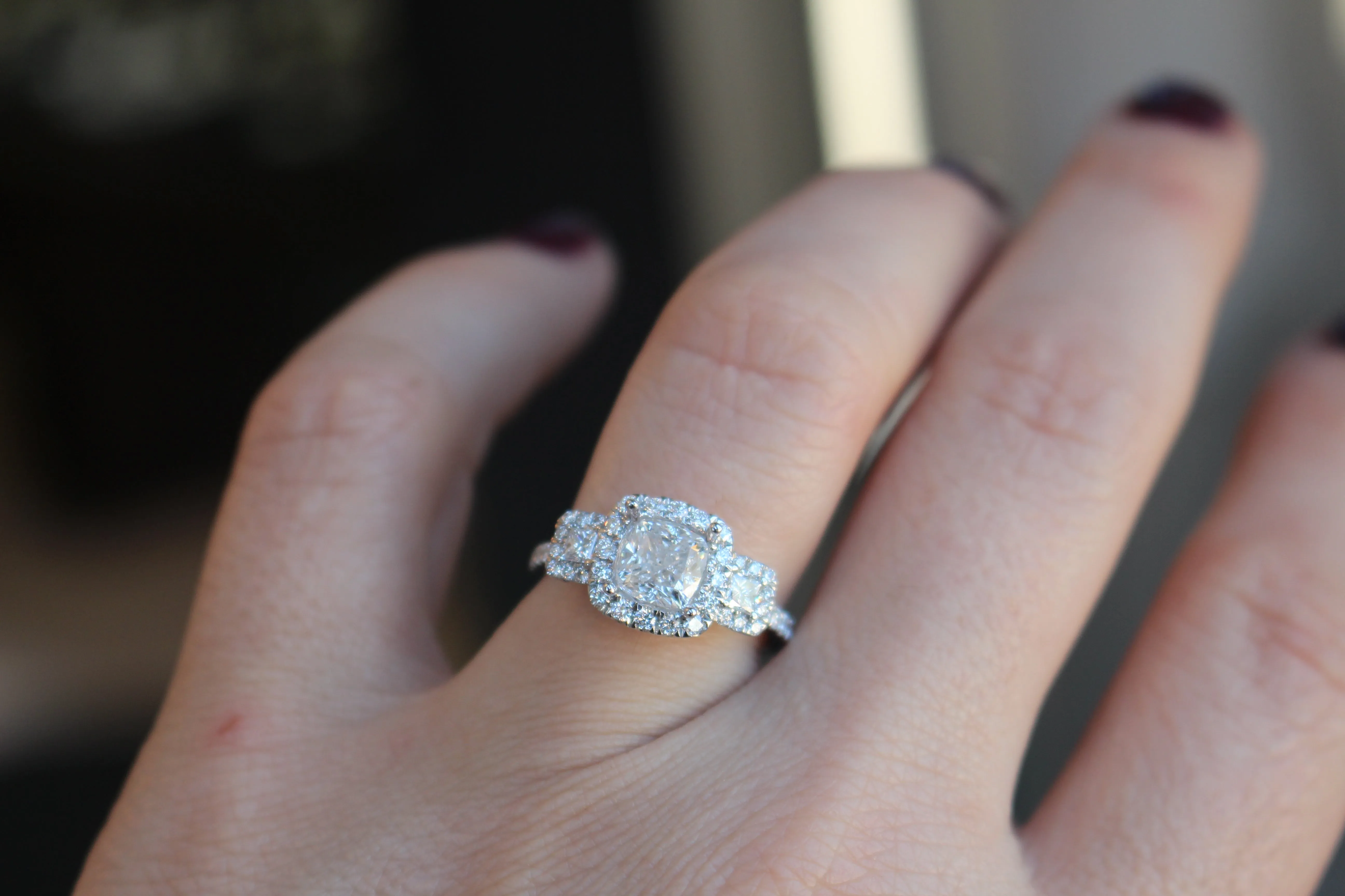 Diamondaire 3 Stone Halo Engagement Ring with a Two-Tone Undercarriage