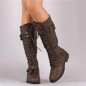 Vintage-style lace-up flat boots for women, featuring steampunk buckles